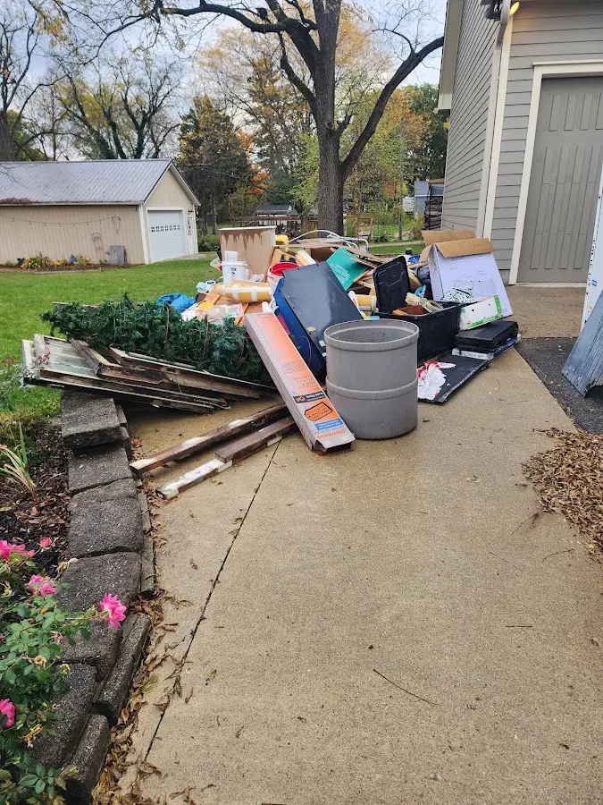Dumpster being loaded with debris for 3 Yard Dumpster Rental in Lordstown